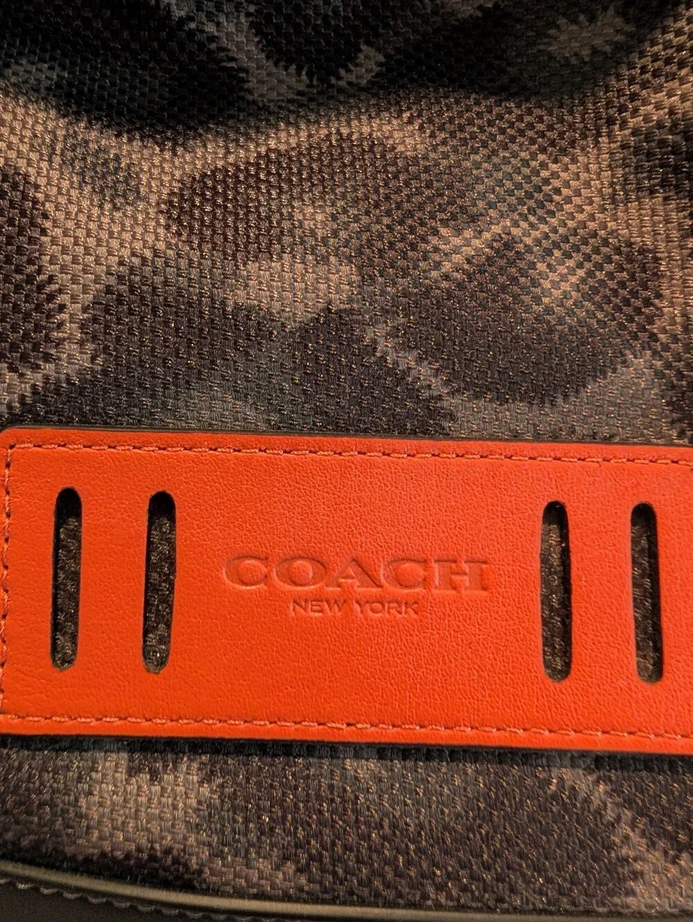 Coach Men's Animal Print Duffle Style Backpack W/Orange Accent